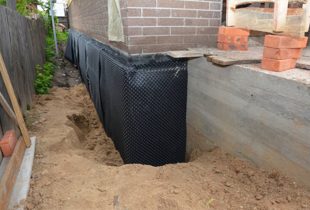 Happy homeowners after waterproofing job in Mattawan